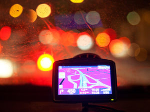 22 Dec 2010 --- Close-up of a digital GPS in the car against blurred lights --- Image by © Nicklas Blom/Matton Collection/Corbis